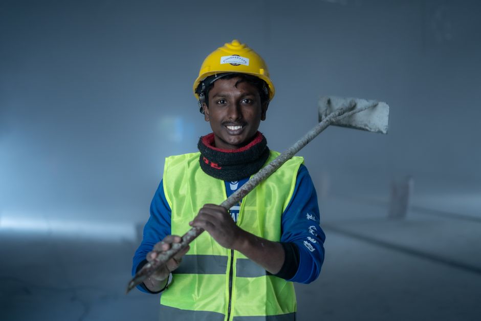 Friendly home insulation and siding contractor smiling at the camera